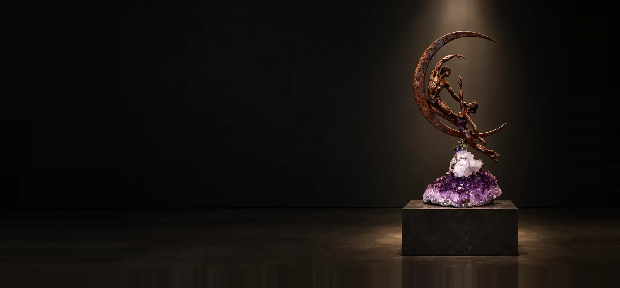 Bronze dancers on a crescent moon rising from an amethyst geode on a pedestal